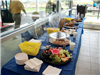 Catered food placed on tables with blue table cloths