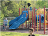 Children Playing on Playground Equipment
