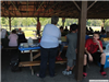 People Standing in Park Shelter