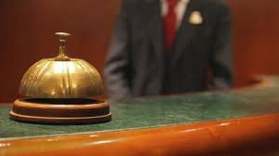 Photograph of bell at hotel reception desk