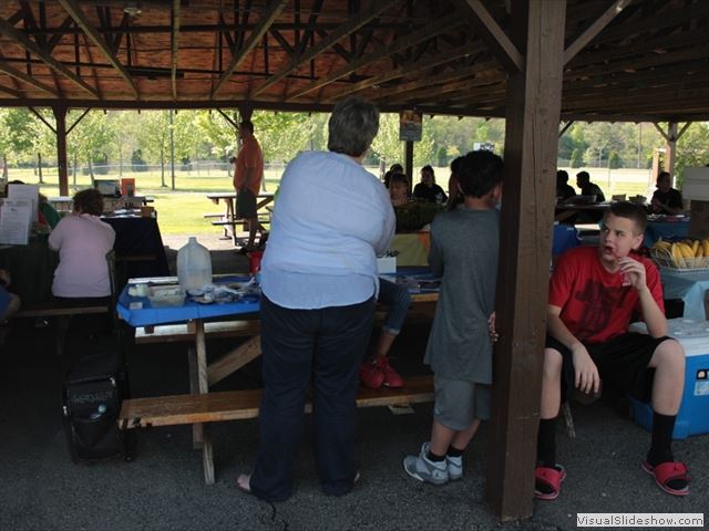 People Standing in Park Shelter