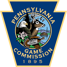 THIS IS A BADGE WITH A PICTURE OF A BUCK REPRESENTING THE PA GAME COMMISSION.